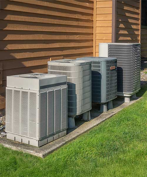 Air Conditioning and Heating Unit outside Apartment Complex Air Conditioning and Heating Unit outside Apartment Complex
