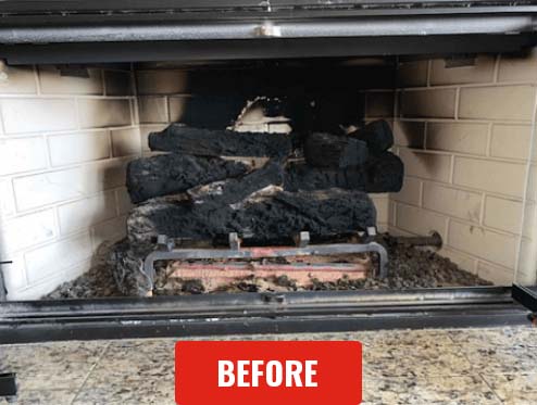 Stock photo of gas logs before cleaning - C&C Chimney Gas logs before cleaning with creosote on the logs