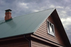 Leaky Chimney Repair and Prevention - Tulsa OK - C&C Chimney green roof with rainy sky