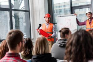 National Chimney Safety Week - Tulsa OK - C&C Chimney two workers teaching fire safety