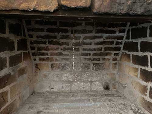 Stock photo of Firebox with no gas logs-C and C Chimney Firebox with no gas logs could use a little sprucing up