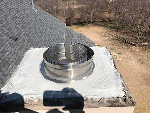 Stock photo after relining - C and C Chimney Chimney after relining with stainless steel and top cut off